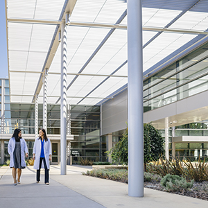 two women walking around uc davis health campus