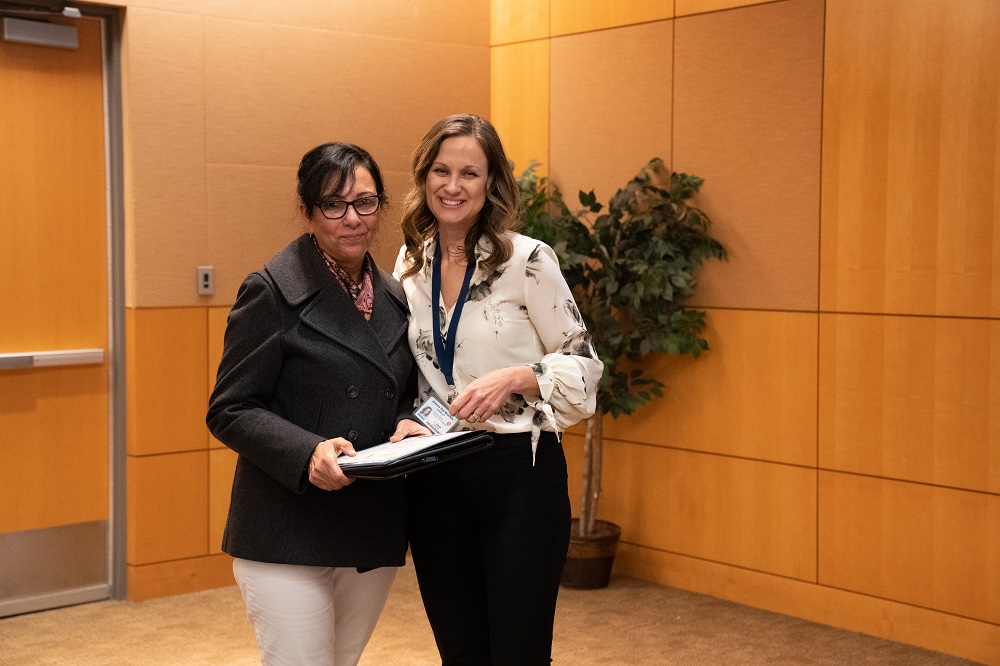 SAW graduate Rosely Kala with program co-facilitator JoAnna Van Brocklin at the graduation ceremony.