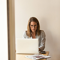 "woman working at her laptop"