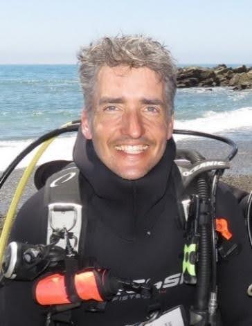 Headshot of Jason Herum wearing diving gear.