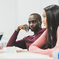 image of two people at a meeting