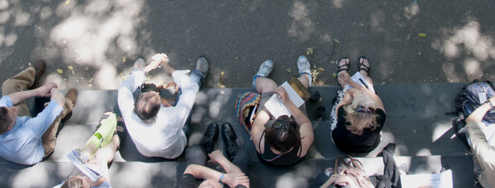 group of people sitting on steps