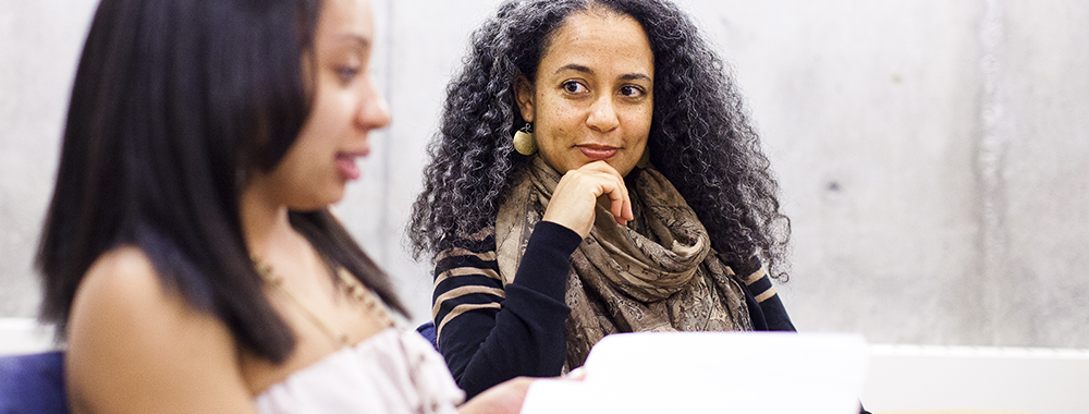 older woman listening while a younger woman speaks