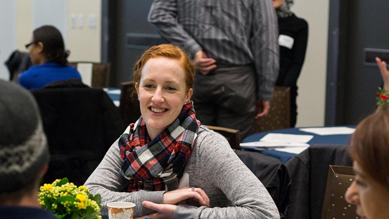 smiling woman at a welcome event