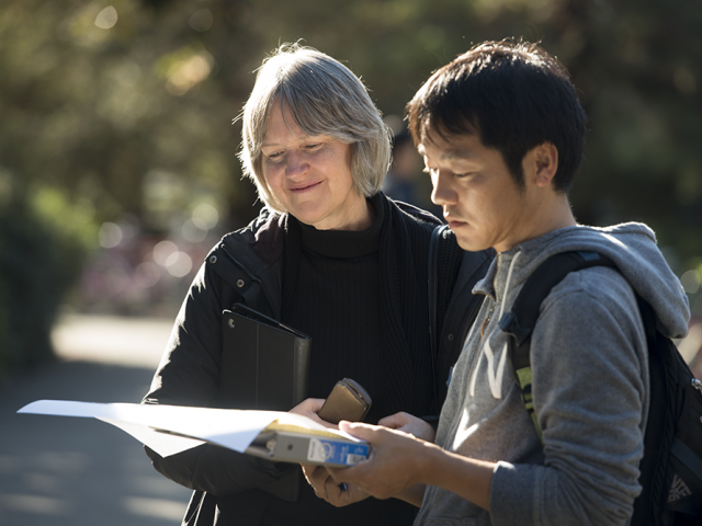 older woman offering advice to a young man