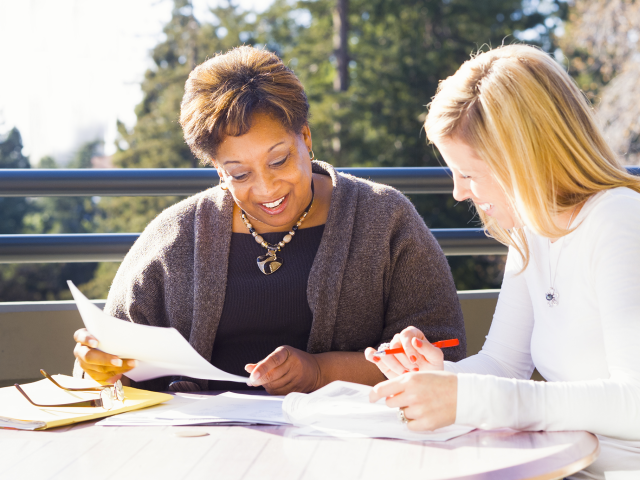 older woman listening while a younger woman speaks