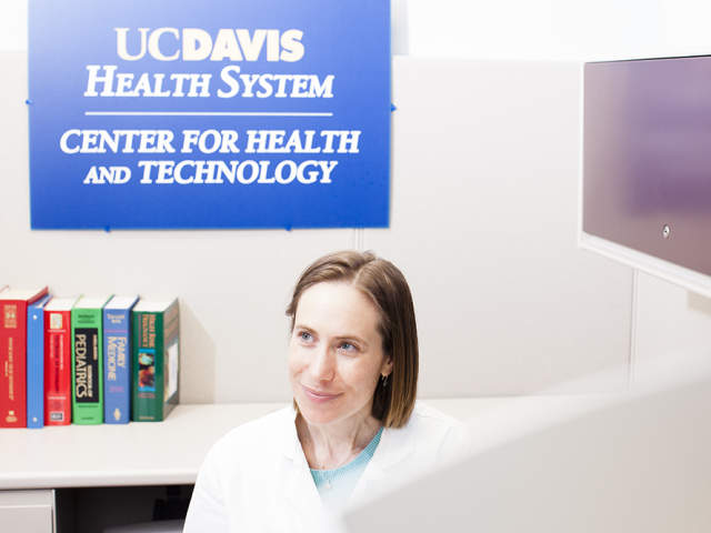 young female doctor looking off camera and smiling