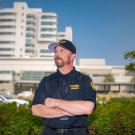 uc davis health employee with hospital in background