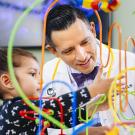 UC Davis Health doctor and child playing a dexterity game. 