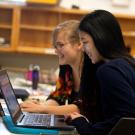 Students looking at a computer