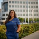 uc davis nurse standing in front of hospital. 