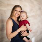 Employee Erin and baby smiling at camera