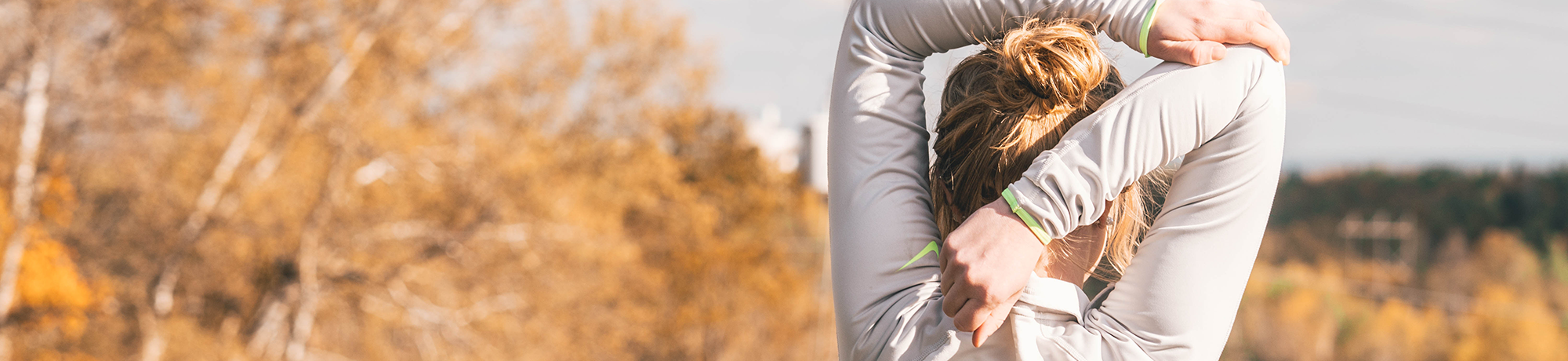 woman stretching before a run outdoors