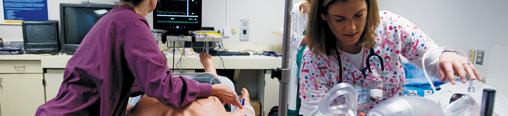 two nurses in the midst of a training exercise