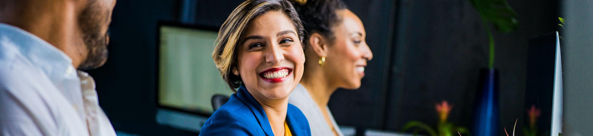 woman smiling at her coworker